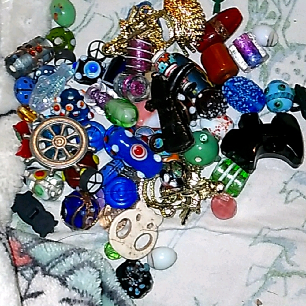 A bunch of glass beads and clay beads